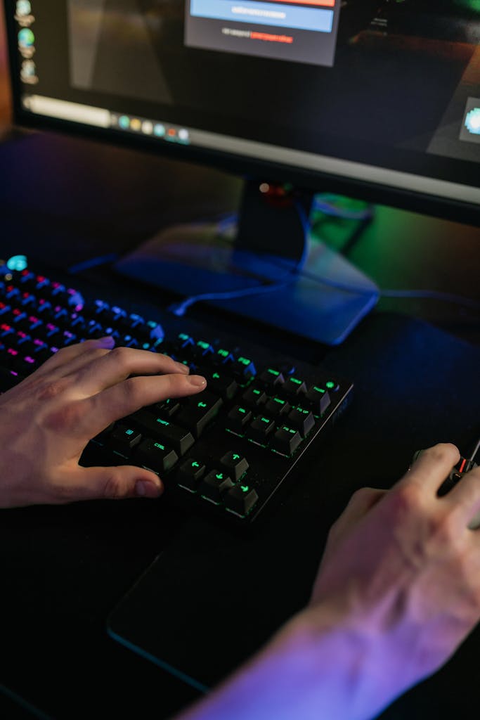 Person Using Black Computer Keyboard